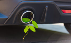 Eco electric hybrid car Environmental concept of the green leaf in exhaust muffler